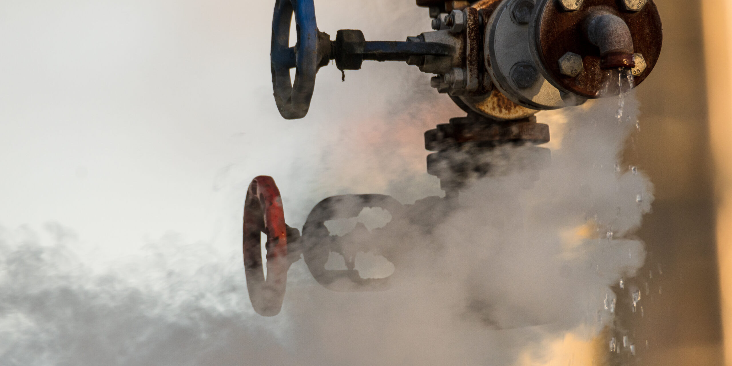 broken valve at the factory hydraulic system, leaking hot liquid